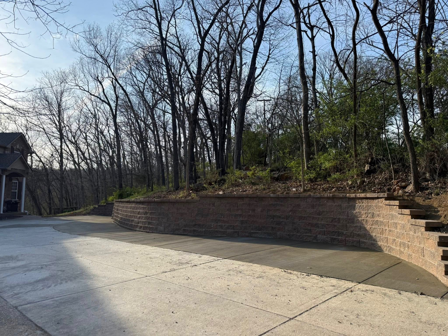 After: Retaining Wall & Driveway Edge by True Form Concrete