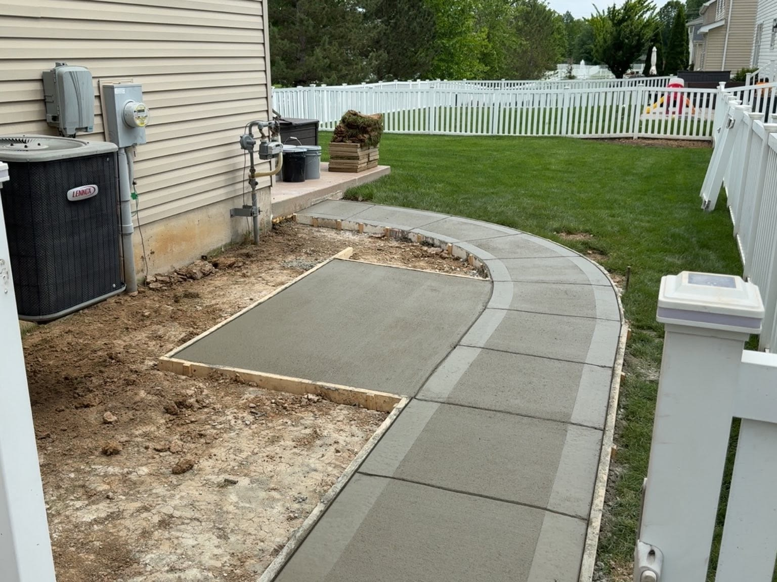 After: AC Pad & Curved Side Walk by True Form Concrete
