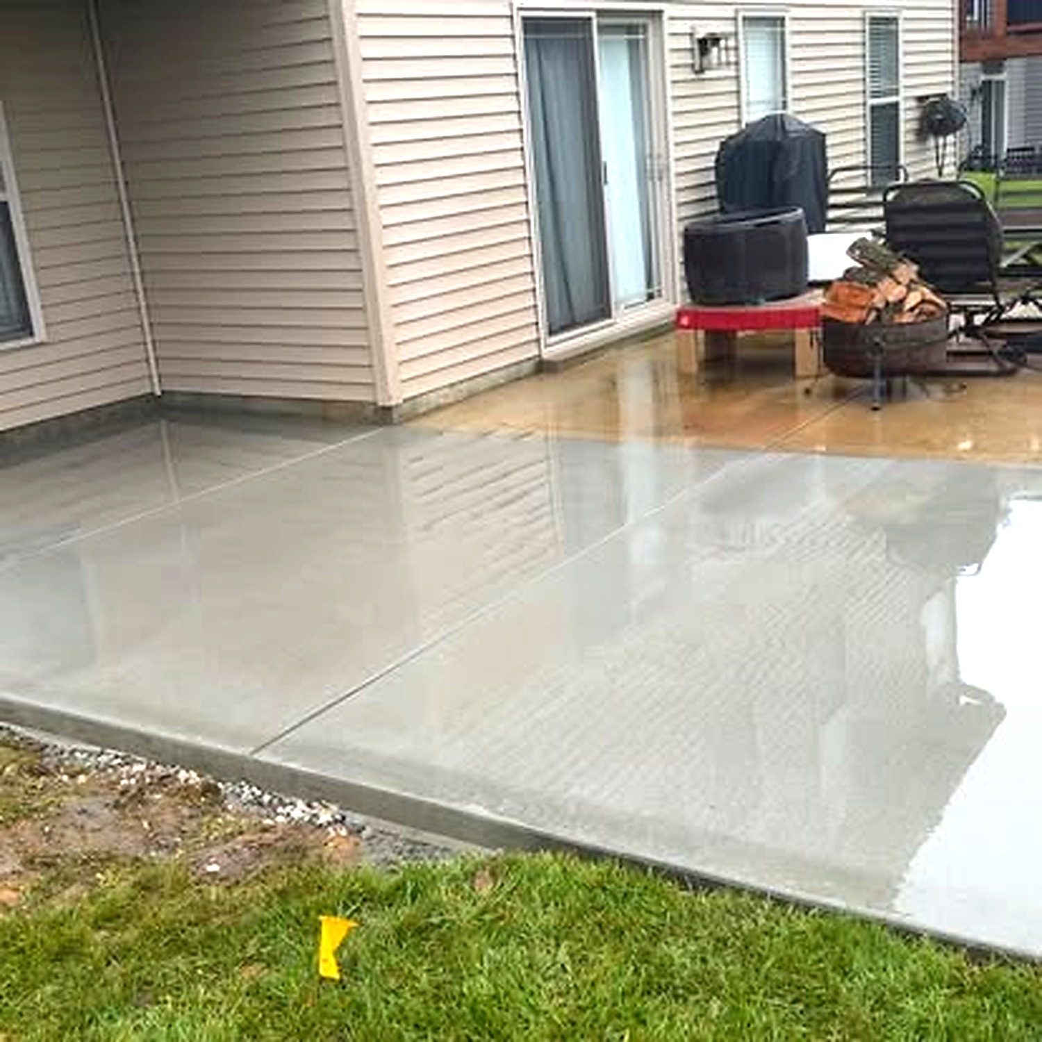Concrete patio with grill area at golden hour — True Form Concrete