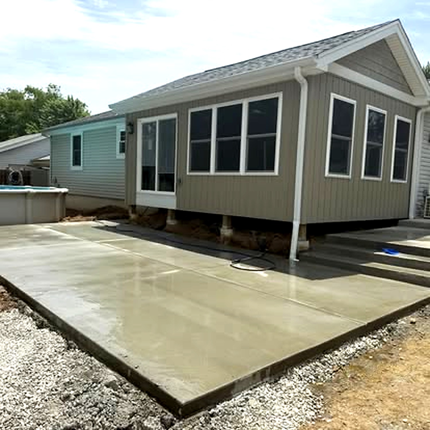 Concrete patio next to pool — decorative finish